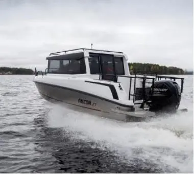 A Falcon 7 boat speeds across water, creating spray, with a Mercury engine visible on the back, set against a cloudy sky.